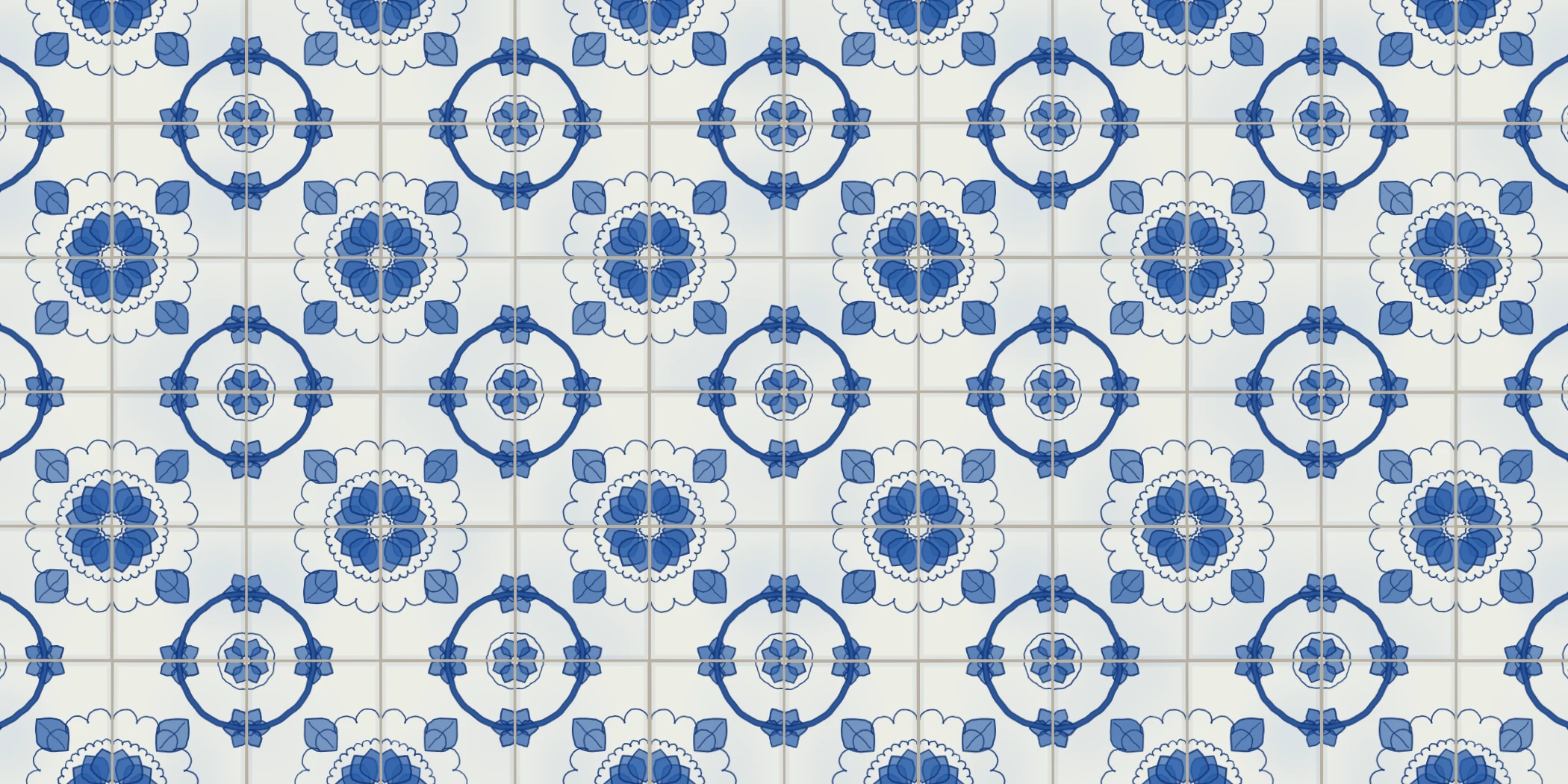 A wall of blue and white tiles, each four forming a rosette with a leaf at every corner